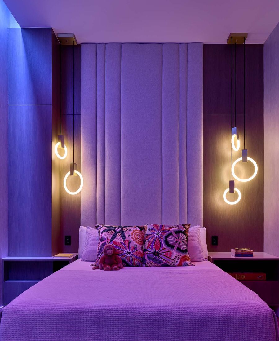 purple toned bedroom with lutron lighting